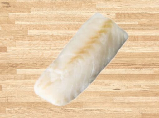 Fresh cod fillet on wooden background.